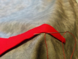 Stitches on the bottom, travel under the fabric and parallel to the top piece